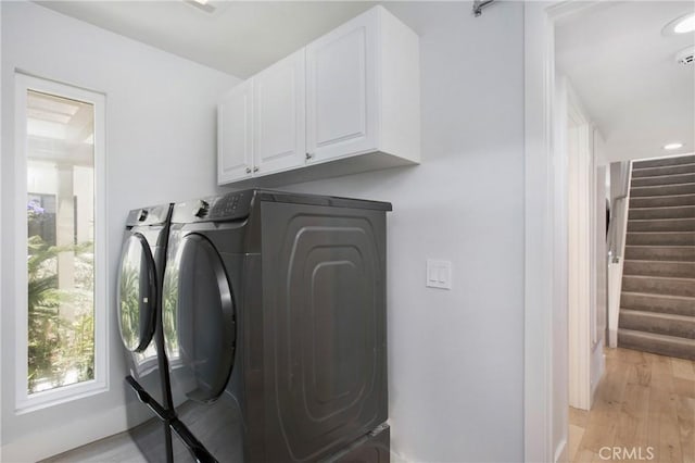 24336 Hillview Dr, Laguna Niguel, CA 92677 - laundry area with washing machine and dryer, cabinet space, and light wood-style floors