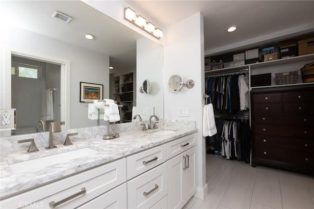 24336 Hillview Dr, Laguna Niguel, CA 92677 - full bathroom featuring double vanity, a spacious closet, and recessed lighting