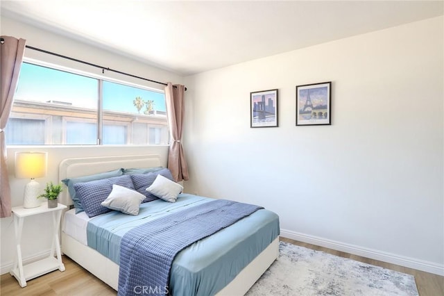 20234 Cohasset St Unit 3, Winnetka, CA 91306 - bedroom featuring light wood-style flooring and baseboards