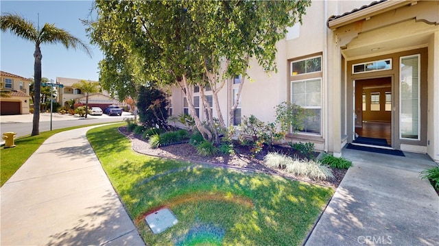 4312 Waterside Ln, Oxnard, CA 93035 - view of exterior entry featuring stucco siding and a tile roof