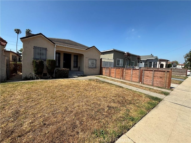 1434 W 92nd St, Los Angeles, CA 90047 - single story home with stucco siding