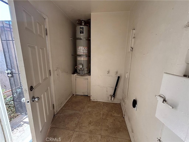 1434 W 92nd St, Los Angeles, CA 90047 - washroom featuring water heater and light tile patterned floors