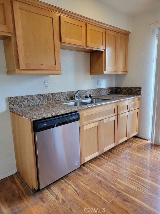 1582 Mitchell Ave, Tustin, CA 92780 - kitchen with dishwasher, a sink, and wood finished floors