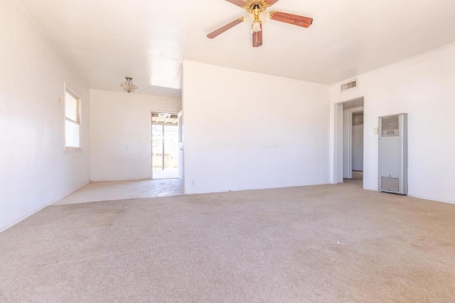 630 N Palm Dr, Brawley, CA 92227 - unfurnished room featuring a heating unit, a ceiling fan, and light carpet