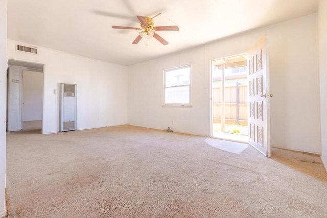 630 N Palm Dr, Brawley, CA 92227 - spare room with a heating unit, ceiling fan, and carpet floors