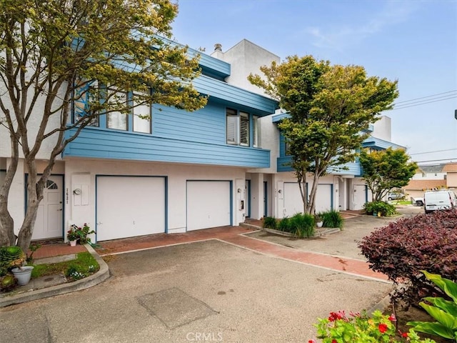 1617 Ramona, Grover Beach, CA 93433 - multi unit property featuring asphalt driveway, stucco siding, and an attached garage