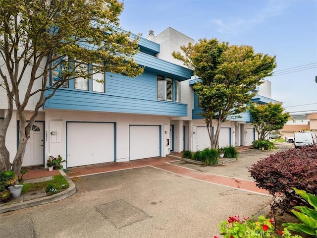 1617 Ramona, Grover Beach, CA 93433 - multi unit property featuring stucco siding, asphalt driveway, and a garage