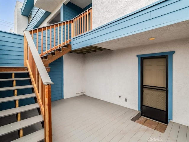 1617 Ramona, Grover Beach, CA 93433 - view of exterior entry featuring stucco siding and a wooden deck
