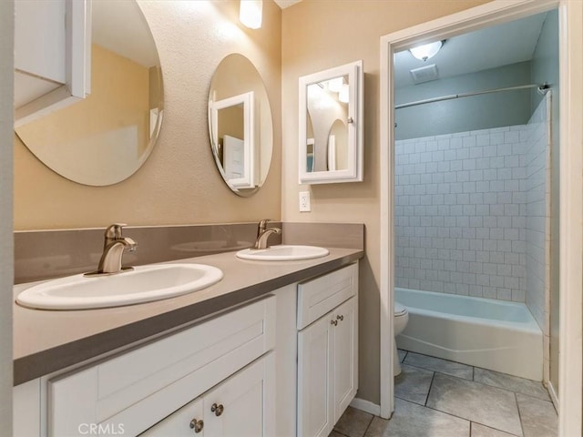 1617 Ramona, Grover Beach, CA 93433 - bathroom featuring toilet, double vanity, washtub / shower combination, and tile patterned flooring