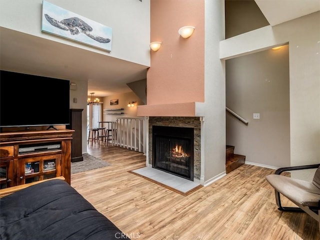 1617 Ramona, Grover Beach, CA 93433 - living room with a chandelier, wood finished floors, stairs, a towering ceiling, and baseboards