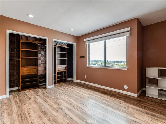 1617 Ramona, Grover Beach, CA 93433 - unfurnished bedroom with light wood-style flooring, two closets, and baseboards