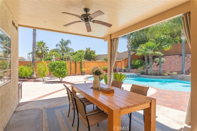 1188 Old Hickory Rd, Corona, CA 92882 - fenced backyard with a patio area, ceiling fan, a pool with connected hot tub, and outdoor dining area