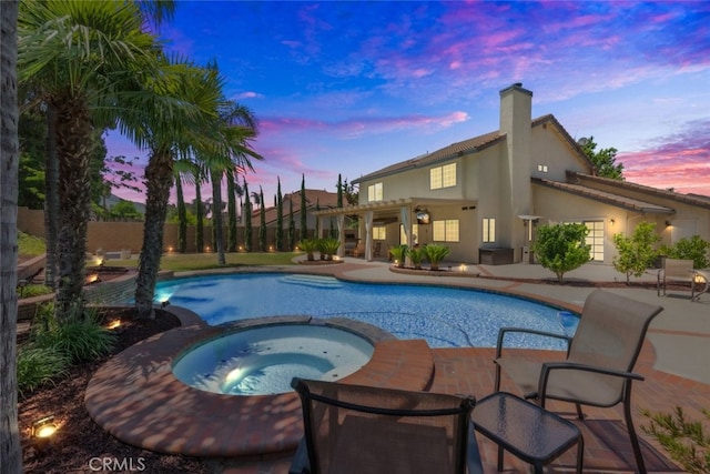 1188 Old Hickory Rd, Corona, CA 92882 - pool at dusk featuring a pergola, a patio, and a pool with connected hot tub