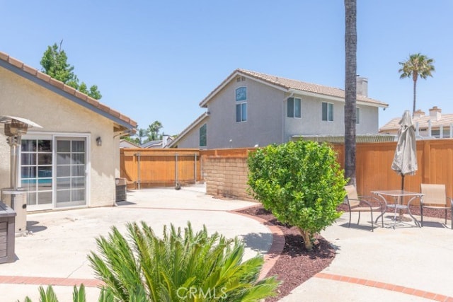 1188 Old Hickory Rd, Corona, CA 92882 - fenced backyard with a patio and outdoor dining space