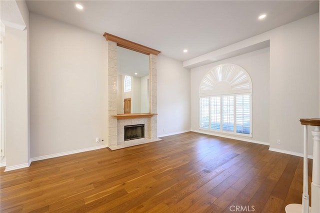 20485 Via Canarias, Yorba Linda, CA 92887 - unfurnished living room featuring wood-type flooring, plenty of natural light, a tile fireplace, baseboards, and recessed lighting