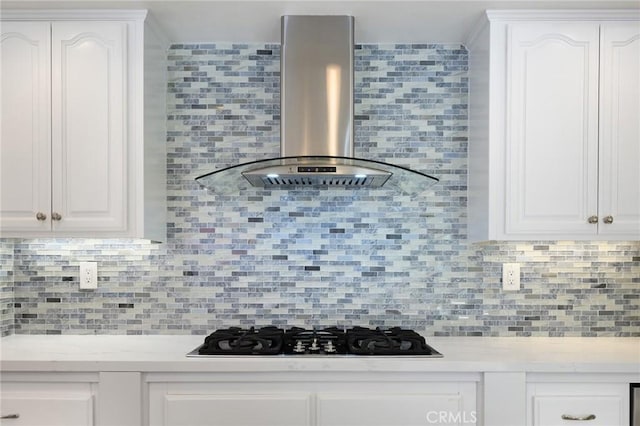 20485 Via Canarias, Yorba Linda, CA 92887 - kitchen featuring wall chimney exhaust hood, black gas cooktop, decorative backsplash, and white cabinets