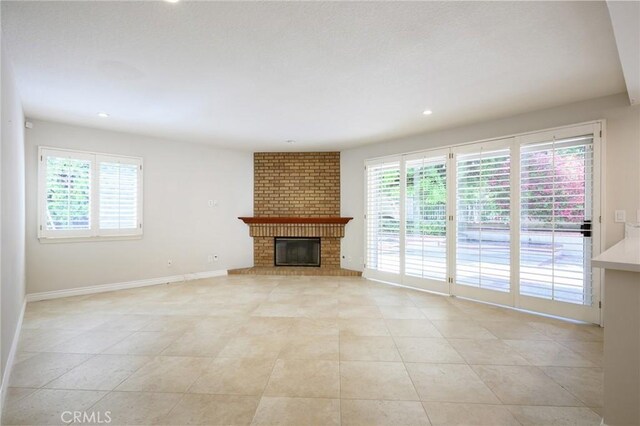 20485 Via Canarias, Yorba Linda, CA 92887 - unfurnished living room featuring plenty of natural light, light tile patterned floors, a fireplace, and recessed lighting