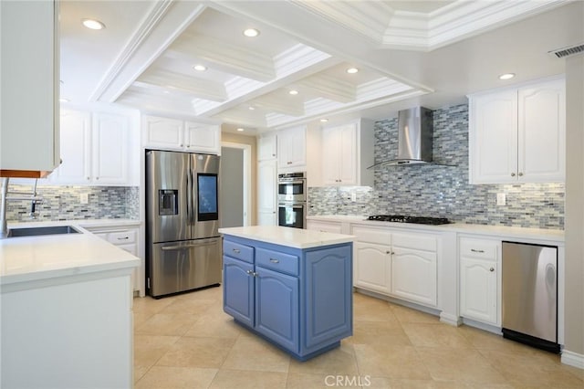 20485 Via Canarias, Yorba Linda, CA 92887 - kitchen with appliances with stainless steel finishes, wall chimney range hood, blue cabinets, white cabinets, and crown molding