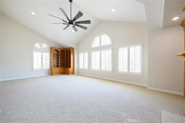 20485 Via Canarias, Yorba Linda, CA 92887 - unfurnished living room with light colored carpet, high vaulted ceiling, a ceiling fan, plenty of natural light, and recessed lighting