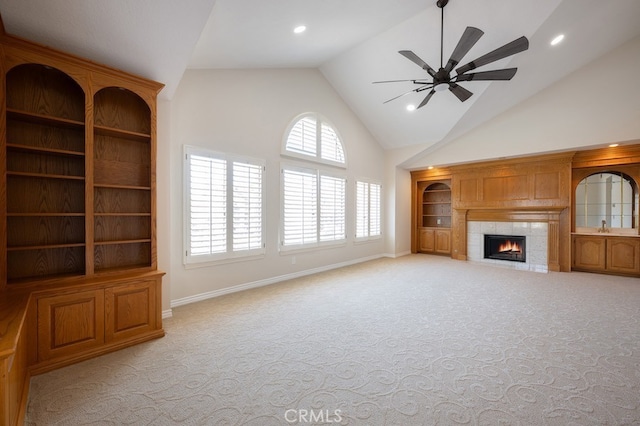 20485 Via Canarias, Yorba Linda, CA 92887 - unfurnished living room featuring high vaulted ceiling, light colored carpet, a ceiling fan, a tiled fireplace, and recessed lighting