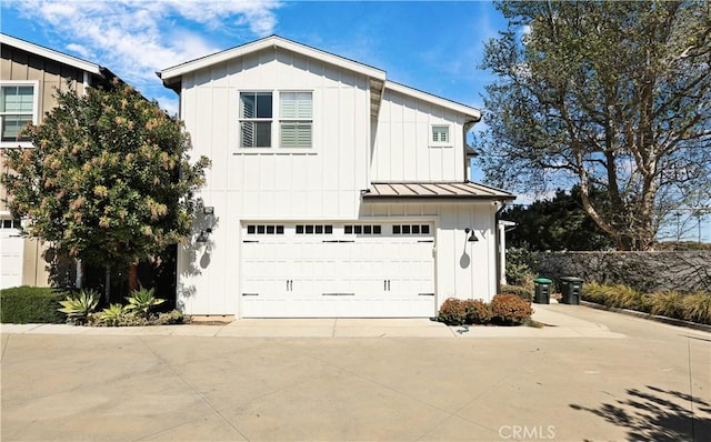 2294 Pacific Ave, Costa Mesa, CA 92627 - modern farmhouse style home featuring board and batten siding, a standing seam roof, concrete driveway, an attached garage, and metal roof