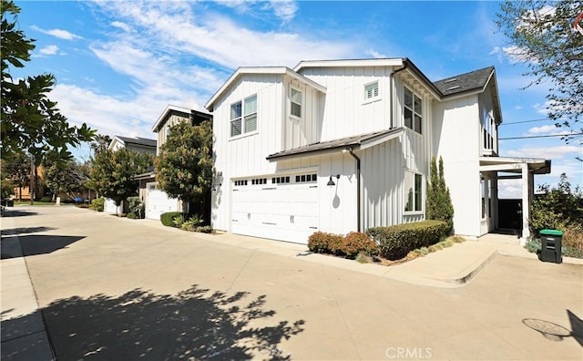 2294 Pacific Ave, Costa Mesa, CA 92627 - view of home's exterior with an attached garage, concrete driveway, and board and batten siding