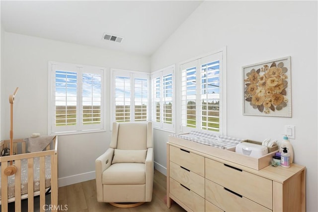 2294 Pacific Ave, Costa Mesa, CA 92627 - bedroom with light wood-type flooring, lofted ceiling, and baseboards