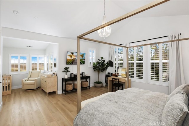 2294 Pacific Ave, Costa Mesa, CA 92627 - bedroom with light wood-style flooring, a chandelier, baseboards, and high vaulted ceiling