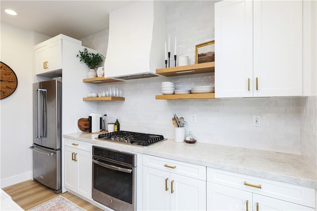 2294 Pacific Ave, Costa Mesa, CA 92627 - kitchen featuring stainless steel appliances, open shelves, custom exhaust hood, tasteful backsplash, and light wood finished floors