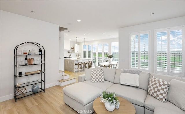 2294 Pacific Ave, Costa Mesa, CA 92627 - living room with light wood-style flooring, baseboards, and recessed lighting