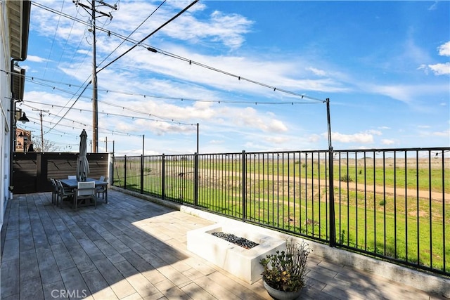 2294 Pacific Ave, Costa Mesa, CA 92627 - view of patio with outdoor dining space, a wooden deck, and a fire pit