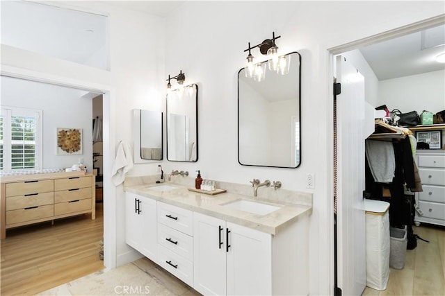 2294 Pacific Ave, Costa Mesa, CA 92627 - full bath with double vanity, wood finished floors, and a spacious closet