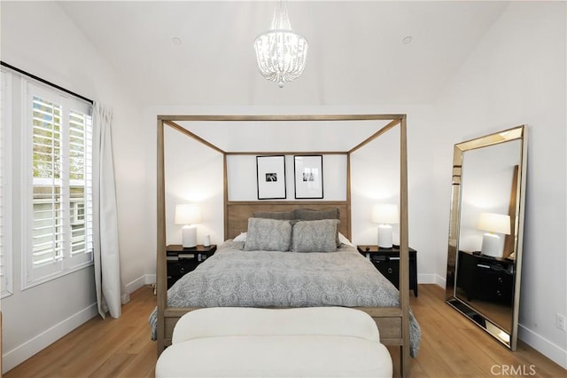 2294 Pacific Ave, Costa Mesa, CA 92627 - bedroom featuring lofted ceiling, light wood-style floors, a chandelier, and baseboards
