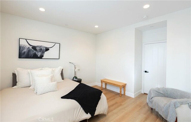 2294 Pacific Ave, Costa Mesa, CA 92627 - bedroom with light wood-style floors, baseboards, and recessed lighting