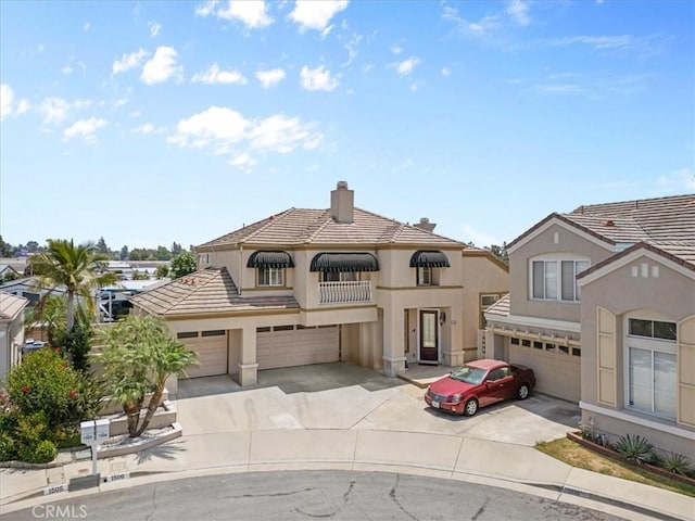 1506 Bergman Ct, Brea, CA 92821 - view of front facade with driveway, a chimney, and stucco siding