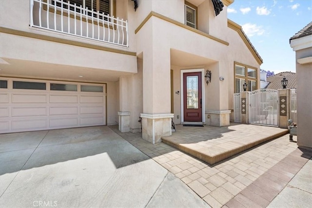 1506 Bergman Ct, Brea, CA 92821 - property entrance with stucco siding, a gate, driveway, and an attached garage
