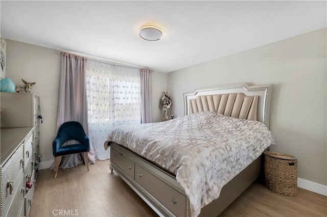 13909 Mountain View Pl, Sylmar, CA 91342 - bedroom featuring light wood-style floors and baseboards