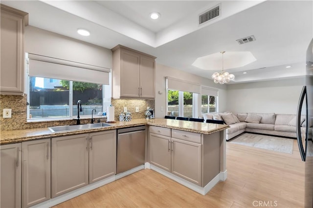13909 Mountain View Pl, Sylmar, CA 91342 - kitchen featuring a tray ceiling, a sink, stainless steel dishwasher, light wood-type flooring, and recessed lighting