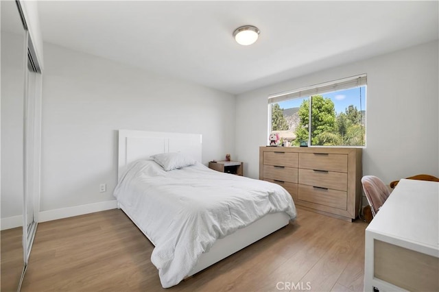 13909 Mountain View Pl, Sylmar, CA 91342 - bedroom with light wood-style floors and baseboards
