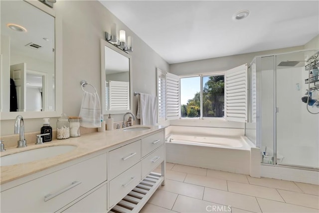 13909 Mountain View Pl, Sylmar, CA 91342 - bathroom featuring a garden tub, a shower stall, double vanity, and tile patterned floors