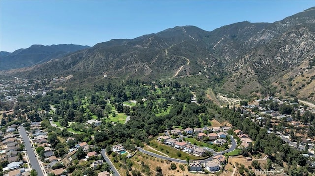 13909 Mountain View Pl, Sylmar, CA 91342 - aerial overview of property's location featuring a mountain backdrop and nearby suburban area
