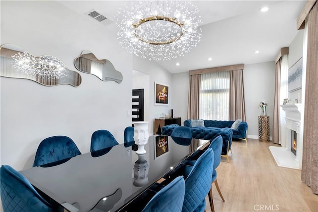 13909 Mountain View Pl, Sylmar, CA 91342 - dining space with wood finished floors, recessed lighting, a lit fireplace, and baseboards