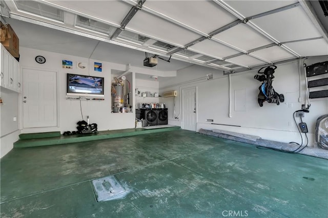 13909 Mountain View Pl, Sylmar, CA 91342 - garage featuring independent washer and dryer, a garage door opener, a wall unit AC, and strapped water heater