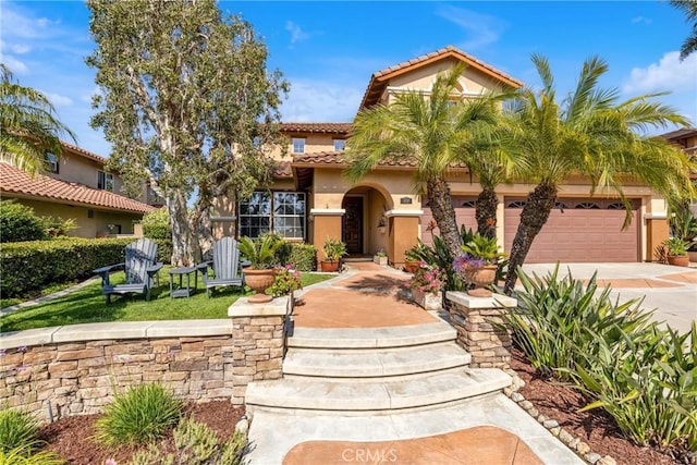 23848 Skyline, Mission Viejo, CA 92692 - mediterranean / spanish home featuring a tiled roof, an attached garage, driveway, and stucco siding