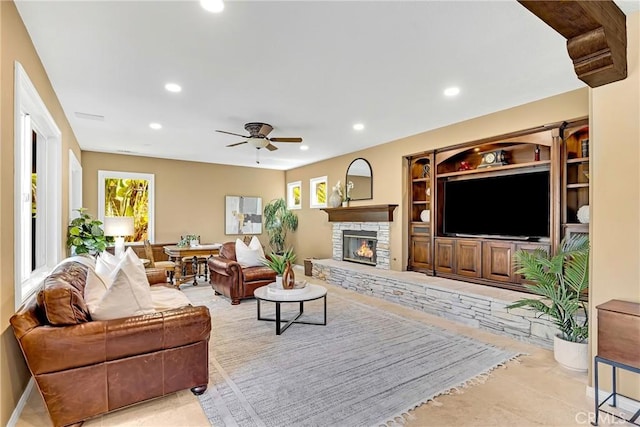 23848 Skyline, Mission Viejo, CA 92692 - living room with healthy amount of natural light, recessed lighting, a ceiling fan, and a stone fireplace