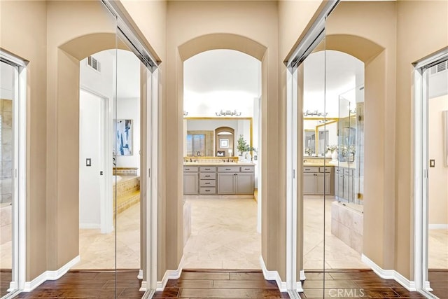 23848 Skyline, Mission Viejo, CA 92692 - hall featuring arched walkways and wood finished floors