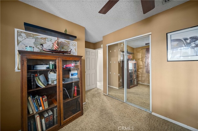 802 Duval St, La Verne, CA 91750 - carpeted bedroom with a textured ceiling, baseboards, ceiling fan, and a closet
