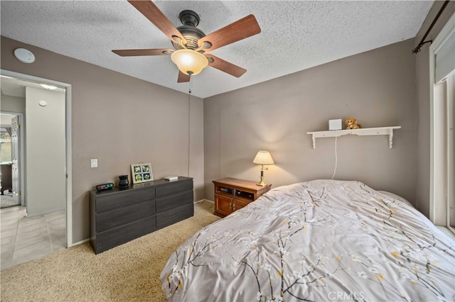802 Duval St, La Verne, CA 91750 - bedroom with light carpet, a textured ceiling, ceiling fan, and baseboards