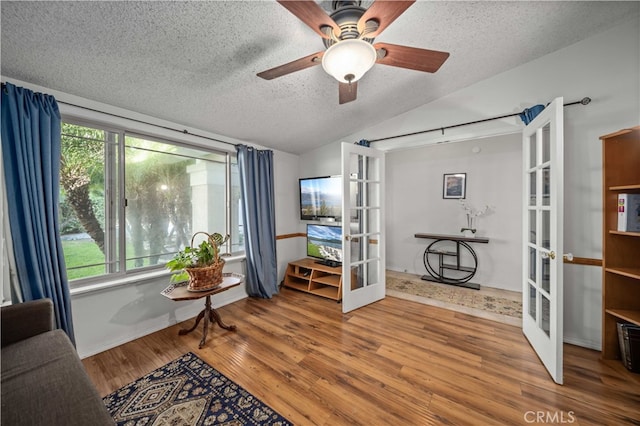 802 Duval St, La Verne, CA 91750 - living area with french doors, a textured ceiling, vaulted ceiling, wood finished floors, and a ceiling fan