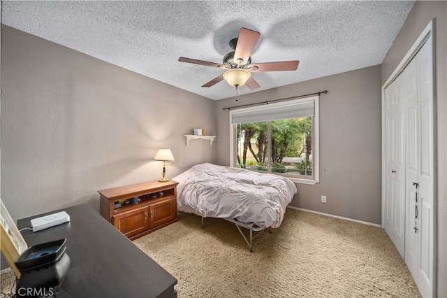 802 Duval St, La Verne, CA 91750 - bedroom with a closet, ceiling fan, a textured ceiling, baseboards, and light carpet